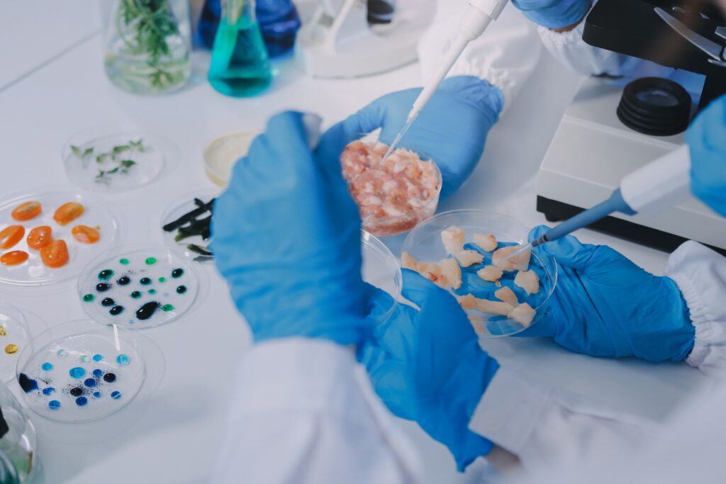 Team,asian,scientists,in,a,lab,conducting,food,research,using